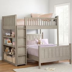 a child's bedroom with a bunk bed and bookcase on the floor next to a window