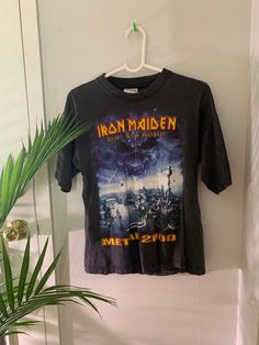 "Condition: Vintage 2000s Iron Maiden tee M. In good condition. Some wear. Tiny hole on the back. Good streetwear Measurements  Size: M Chest: 19\"                                      Length: 24\"  - No refunds or Exchanges. - You may privately massage me if you need further clarification on any items." Distressed Y2k Crew Neck Top, Distressed Y2k Crew Neck T-shirt, Y2k Distressed T-shirt For Streetwear, Y2k Distressed Crew Neck T-shirt, Y2k Distressed Cotton T-shirt, 90s Distressed T-shirt For Streetwear, Iron Maiden T Shirt, Concert Tees, Vintage 2000s