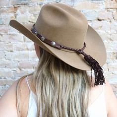 Each of these special hat bands is hand-crafted by a lovely retired couple living in Montana, USA. The leather is buttery soft and the leather braid shows the quality and craftmanship of their work. Customizations: Upon request, this hat band can be crafted in many other colors. Instead of braided knobs, it can be finished with long leather tassels. And different conchos are also available. Please allow up to 6 weeks for custom requests. Rustic Adjustable Felt Hat With Short Brim, Adjustable Fur Felt Hat For Western-themed Events, Rustic Leather Fedora Felt Hat, Classic Brown Handmade Hat, Country Style Fur Felt Hat Bands For Country Events, Adjustable Fur Felt Hat Band For Rodeo, Artisan Adjustable Felt Hat For Rodeo, Rustic Brown Leather Felt Hat, Brown Braided Hat With Curved Brim