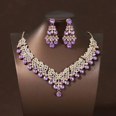 43546970947764 Purple Party Jewelry, Elegant Purple Rhinestone Necklace For Party, Purple Crystal Jewelry Sets For Wedding, Purple Bridal Earrings For Party, Purple Costume Jewelry For Party, Purple Costume Jewelry For Wedding, Party Alloy Jewelry With Matching Earrings, Party Jewelry With Matching Alloy Earrings, Purple Crystal Jewelry Set For Party