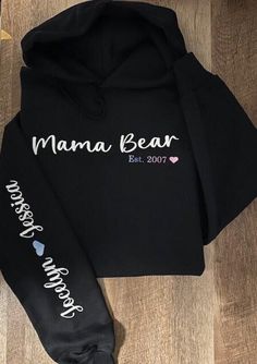 Personalized Mama Bear hoodie with name (s) on arm. Perfect for Mother's Day, Valentine's Day, etc.  Care Instructions - To keep your products in great condition, we recommend washing them inside out with similar colors on cold rinse. - Please use non-chlorine bleach only and tumble dry at a low setting. - Ironing is safe at a medium temperature, but please avoid ironing directly on the decoration. - Dry cleaning is not necessary. Personalized Long Sleeve Cotton Hoodie, Cotton Hooded Sweatshirt For Mother's Day, Casual Personalized Hooded Hoodie, Personalized Cotton Hoodie For Winter, Personalized White Cotton Hoodie, Casual Personalized Cotton Hoodie, Casual Personalized Crew Neck Hoodie, Long Sleeve Hoodie With Letter Print For Mother's Day, Casual Crew Neck Hoodie With Personalization