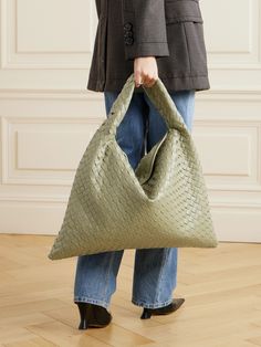 This beautifully crafted tote is undoubtedly Bottega Veneta - it's woven from strips of sage-green leather using the house's signature intrecciato technique. Defined by its slouchy shape, it's sized to perfectly hold a laptop, planner and water bottle and has a curved shoulder strap. Sage Green Bag Outfit, Green Intrecciato Weave Tote Shoulder Bag, Everyday Green Shoulder Bag With Intrecciato Weave, Luxury Green Hobo Tote Bag, Green Woven Leather Shoulder Bag For Errands, Luxury Green Woven Leather Bags, Luxury Green Soft Leather Hobo Bag, Green Leather Hobo Bag With Braided Handles, Bottega Veneta Bag Tote