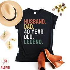 a t - shirt that says husband, dad, 40 year old legend and hat