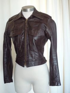 "right out of my incredible vintage closet...it is time for some other petite woman out there to enjoy this outrageous authentic harley davidson chocolate brown jacket..women's size 34 ..excellent vintage condition...obviously well cared for..measures: laying flat, 22\" pit to pit, 23\" shoulder seam to cuff, 15\" shoulder seam measured across the back, 22.5\" long and a 32\" waist..please measure yourself and compare measurements..no returns on sizing..best fits size 2 or 4 women's ..fantastic Fitted Vintage Brown Leather Winter Jacket, Fitted Vintage Brown Leather Jacket For Winter, Fitted Distressed Brown Outerwear, Classic Fitted Vintage Brown Biker Jacket, Fitted Classic Vintage Brown Biker Jacket, Vintage Brown Fitted Leather Jacket For Fall, Fitted Vintage Brown Leather Jacket For Fall, Fall Fitted Vintage Brown Leather Jacket, Fitted Brown Leather Biker Jacket