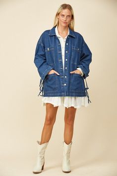 This Stop and Stare Denim Jacket with a button-down front and tie-enclosure on the side are flattering and stylish, making it a great staple denim jacket. 100% Cotton Unlined Button-Front Oversized fit Side Tie-Enclosure