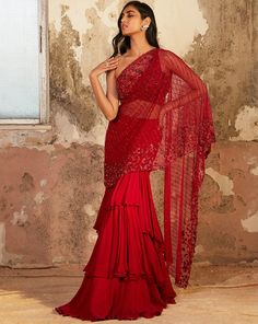 Red one shoulder floral pearl hand embellished blouse featuring a cut out back, paired with a layered georgette Saree with an attached hand embellished drape.From Shloka Khialani's Elysium collection. DELIVERY TIMEPlease allow 6-8 weeks for your outfit to arrive. FABRIC DETAILSGeorgette, net, crepe Professional cleaning only. Georgette Skirt, Red Outfits, Net Blouses, Drape Saree, Embellished Blouse, Trendy Blouses, Party Wear Indian Dresses, Indian Attire, Fancy Sarees