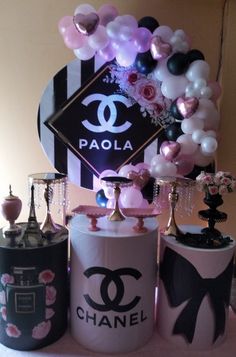 a chanel themed birthday party with balloons and decorations