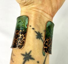 These unique, hand-formed copper and brass cuff bracelets with vibrant patinas create stunning accents to your personal style. Dress up or down- either way you'll be wearing an adornment that will turn heads, start conversations, and delight the eye of the beholder. This is a wide, hammered copper cuff with antique and green patinas. Colors look slightly different depending on the device you view the product on. This is a small size cuff, see measurements below. Cuffs have a 1” gap. Use a fabric Unique Green Cuff Bracelet For Festival, Unique Green Patina Cuff Bracelet, Artisan Electroformed Cuff Bangle Bracelet, Artistic Copper Cuff Bracelet Bangle, Artistic Copper Cuff Bangle Bracelet, Artistic Copper Cuff Bracelet, Artistic Adjustable Patina Cuff Bracelet, Adjustable Green Cuff Bracelet With Patina, Adjustable Patina Cuff Bracelet Wearable Art