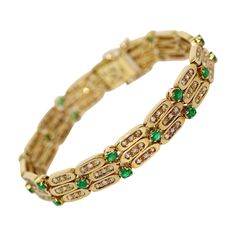 Ladies Gold Bracelet set with Diamonds and Emeralds. 18 Karat yellow gold. Finest goldsmith work. Diamonds (Wesselton, I1) total weight 1.15 ct. 23 emeralds, total weight approx. 1.78 ct. Including certificate of authenticity. Yellow Gold Jeweled Round Bracelets, Green Jubilee Gold Bracelet For Formal Occasions, Formal Green Gold Jubilee Bracelet, Gold Bracelets With Jewels For Anniversary, Formal Green Bracelets With 17 Jewels, Luxury Green Gold Bracelet For Anniversary, Classic 14k Gold Green Bracelet, Classic Green 14k Gold Bracelet, Ladies Bracelet