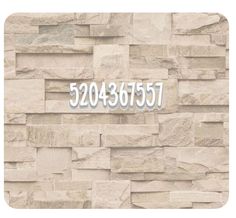 a stone wall with the number 3500 in white on it and an address sticker