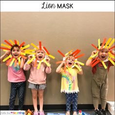 three children standing in front of a wall holding up their hands with the words lion mask on them