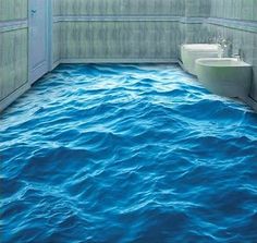 a bathroom with blue water on the floor