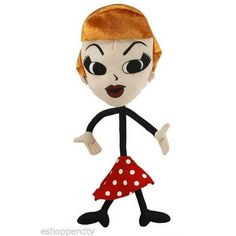 a stuffed doll with red hair and polka dot dress, giving the thumbs up sign