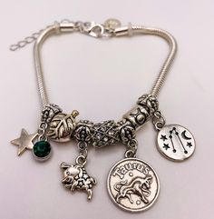 Taurus Charm Zodiac Bracelet expresses your characteristic traits of being a Taurus while wearing it. Express your independence, honesty, and compassion with this divine Zodiac Bracelet, which is made out of sterling silver snake chain with stainless steel silver coated Sagittarius sign, symbol, & constellation stars. After all, you deserve a Taurus Charm Zodiac Bracelet to encourage you to bring out your independent side, while expressing your unique & one-of-a-kind self! Embrace your inner sel Silver Zodiac Sign Symbolic Bracelets, Silver Zodiac Sign Bracelet, Silver Zodiac Sign Symbolic Bracelet, Sagittarius Sign Symbol, Characteristic Traits, Constellation Stars, Sagittarius Sign, Zodiac Bracelet, Silver Snake Chain