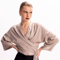 Easy and versatile, this blouse is crafted from high quality viscose fabric and has wide kimono sleeves. It is designed to wrap & tie in different ways. Wrap it around the waist and tie the straps at the front side, for a more classic look. Or cross the straps in the middle front (semi-tie, braided) and then wrap them around the waist and tie them either on the back or the front.  Pair it with its coordinating bias-cut skirt from the collection.   All pieces are cut one by one for an impeccable Silk Wrap Blouse For Evening, Chic Wrap Blouse With Tie Sleeves, Silk Evening Wrap Blouse, Spring Season Formal Wrap Blouse, Spring Formal Wrap Blouse, Silk Tops With Draped Sleeves For Work, Silk Top With Draped Sleeves For Work, Chic Silk Wrap Blouse, Spring Formal Wrap Top