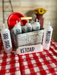 some ketchup bottles are sitting on a table