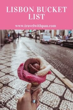 a person holding an ice cream cone in their hand with the words lisbon bucket list