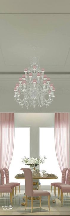 a dining room with pink chairs and a chandelier