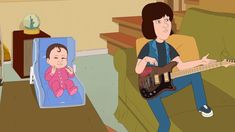 a person sitting on a couch with a guitar in front of him and an image of a baby