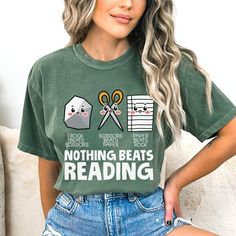 Rock Paper Scissor Reading Shirt, Book tshirt, Reading Teacher T-shirt, Bookworm Shirt, Teacher Tee, Book Lover Gift Comfort Colors introduces the "Comfort Colors 1717" garment-dyed t-shirt;  tee made 100% with ring-spun cotton. The soft-washed, garment-dyed fabric brings extra coziness to your wardrobe while the relaxed fit makes it an excellent daily choice. The double-needle stitching throughout the tee makes it highly durable while the lack of side-seams helps the shirt retain its tubular sh Bookish Short Sleeve T-shirt With Funny Text, Bookish T-shirt With Funny Print And Short Sleeves, Short Sleeve T-shirt With Funny Text, Graphic Print Crew Neck T-shirt For Reading, Bookworm Shirt, Rock Paper Scissors, Reading Teacher, Reading Shirts, Book Tshirts