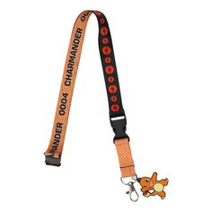 an orange and black lanyard strap with a cartoon character on the front, in red letters