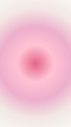 an abstract pink and white background with a circular design in the center, as if it were blurred or blurry