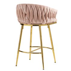 an upholstered stool with gold legs and a pink velvet cushion on the back