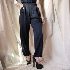 From YSL’s Rive Gauche line, these trousers are the perfect staple to add to your closet. The double button waistband and double pleats in the front allow for a comfortable yet incredibly flattering fit and the loose, almost wide leg cut of the trousers allow for easy styling with sneakers and heels alike. Beautiful and well-made, these are a great example of why people shop vintage. Size: FR 36, US 2/4 Composition: 100% wool Condition: Perfect, no visible stains, snags, holesMeasurements: Waist Navy Trousers, Rive Gauche, People Shopping, Why People, Vintage Shops, Yves Saint Laurent, Saint Laurent, Wide Leg, Composition