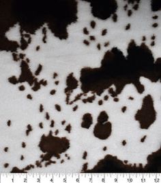 an animal print is shown in black and white, with brown spots on the fur