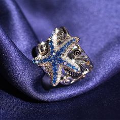 Discover the Transformative Power of the Sapphire Starfish Silver Ring Embrace the beauty and healing energy of the Sapphire Starfish Silver Ring. This exquisite piece is not just a piece of jewelry; it is a symbol of renewal, emotional balance, and spiritual growth. Specifications: Style: Trendy Shape/Pattern: Geometric Setting Type: Prong Setting Rings Type: Wedding Bands Item Weight: 2g Item Type: Rings Emotional Benefits: Wearing this ring can help you: Enhance Intuition: Sapphires are known Starfish Ring, Diamond Party, Rainbow Topaz, Party Women, Cluster Rings, Party Rings, Luxury Rings, Emotional Balance, Ring Color