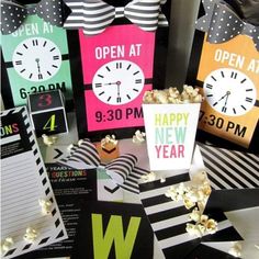 popcorn buckets with happy new year's eve signs and movie tickets on them