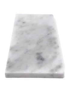 a white marble counter top against a white background