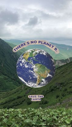 there's no planet b save the earth sign on top of a green mountain