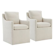 a pair of white chairs sitting next to each other