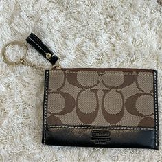 New Without Tags (Never Used) Top Zipper Closure Slip Pocket In Back Gold Keychain/Hardware Black Lining/ Black Leather Accents Width - 4 ½" Height - 3 ¼" Can Tuck Keychain Inside If Not Using Perfect For Credit Cards To Throw Inside A Bigger Purse Keychain Hardware, Purse Aesthetic, Gold Keychain, Coin Purse Wallet, Leather Accents, Credit Cards, Coach Bags, Purse Wallet, Black And Brown