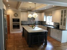 a large kitchen with an island in the middle