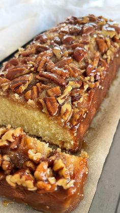 a loaf of pecan bread on a piece of parchment paper