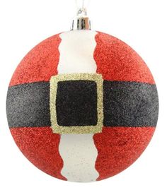 a red and white ornament with a black square on it's center