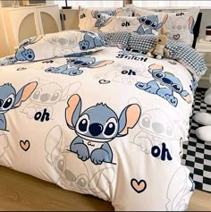 the bed is decorated with cartoon characters on it