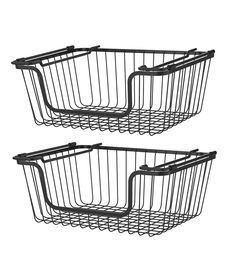 two black wire baskets sitting next to each other