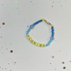 Florida Bracelet Beaded Single Strand Friendship Bracelet the Tortured Poets Department Era - Etsy Adjustable Rosary Bracelet With Letter Beads For Friendship, Friendship Rosary Bracelet With Letter Beads, Friendship Beaded Name Bracelet, Beaded Name Bracelet With Round Beads For Friendship, Hand-strung Round Beads Name Bracelet For Friendship, Everyday Beaded Name Bracelet, Friendship Letter Beads Bracelet, Adjustable Beaded Bracelets With Letter Beads As Souvenir, Poets