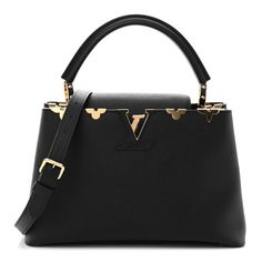 This is an authentic LOUIS VUITTON Taurillon Embellished Flower Crown Capucines PM in Black. This beautiful shoulder bag is composed of luxurious textured calfskin leather in black.The handbag features a single rolled leather reinforced top handle with stylized links, and a crossover flap that inserts behind theprominent black and gold LV. This opens to a partitioned black leather interior with a zipper pocket. Luxury Epsom Leather Shoulder Bag For Evening, Elegant Shoulder Bag With Branded Hardware And Epsom Leather, Elegant Epsom Leather Shoulder Bag With Branded Hardware, Luxury Purses, Beautiful Bags, Leather Interior, Authentic Louis Vuitton, Flower Crown, Black And Gold