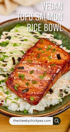 a plate with rice, meat and vegetables on it that says vegan tofu salmon rice bowl