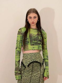 𝔇𝔢𝔱𝔞𝔦𝔩𝔰: Style: Fairy Grunge, Streetwear, Y2K Material: Spandex (Stretchable) This mesh top features a graffiti pattern and split sleeves, which can be your inspiration for making a grunge fairy look. With its stretchy fabric, this top can perfectly fit your body. Get free shipping with a purchase of over 80 $ at our store Model wears s with 5'5, 110 lbs SIZE LENGTH BUST SLEEVES 27 in 26-35 in 15 inM 28 in 28-36 in 16 inL 28 in 30-38 in 16 inItem measured by hands may have 1-2 in differences.... Fairy Grunge Tops For Spring Party, Fairy Grunge Long Sleeve Party Top, Fairy Grunge Long Sleeve Top For Party, Spring Fairy Grunge Party Tops, Trendy Fitted Green Mesh Top, Fitted Green Mesh Top, Fairycore Tops For Spring Party, Green High Stretch Party Tops, Spring Fairycore Party Tops