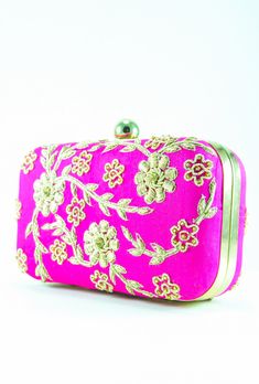 Zardozi and Dabka Exquisite Fabled Craft clutch, perfect for any occasion. A colored metal frame surrounds the bag and is finished with a clasp lock. The interior is lined in colored cotton to complement the bag and has gusseted sides to keep your contents secure. The bag also features a detachable chain so that it can be worn on the shoulder. Raw Silk Pink Color Imported DIMENSIONS Approx 6x4x2 inches SHIPPING & RETURNS Product will be shipped within 1 to 2 weeks from the date of purchase. Indian Currency, Bridal Clutches, Flower Clutch, Side Purses, Indian Accessories, Designer Clutch Bags, Embroidered Clutch, Pink Clutch, Bridal Clutch