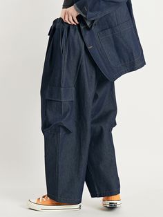 Editor's NotesThese balloon pants are built with room to move, and relaxed through the hip and thigh, with a full leg.These cargo pants are made with cotton.- Side pockets- Balloon cargo pants with elastic waistband- Wide leg pants- Pintuck design on the bottom of the pants Measurements(in.)One size- Total length: 37.8in.- Waist: 13.39 to 20.08in. - Hips: 27.47in.- Thigh: 17.39in. - Front rise: 16.6in.- Leg opening: 10.24in.Model Size Woman Height - 5’ 57”Weight - 110lbM Baggy Utility Cargo Jeans, Denim Blue Cargo Trousers, Baggy Denim Blue Cargo Pants With Belt Loops, Baggy Cargo Jeans With Straight Legs In Utility Style, Indigo Wide-leg Pants With Pockets, Utility Denim Cargo Pants In Straight Cut, Utility Denim Straight Cargo Pants, Utility Denim Cargo Pants Straight Fit, Utility Cargo Jeans With Loosely Fitted Hips