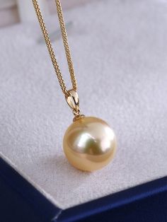 * Condition: Brand new * Center Stone: Natural Golden South Sea Pearl 9-10mm/10-11mm/11-12mm/12-13mm/13-14mm (options) * Pearl Shape Grade: Perfectly Round * Metal Purity: 18K Solid Yellow Gold * Chain Length: 45cm * Superior pearls standard - 99% of the pearl surface is clean. An extremely detailed and up-close study of the pearl is needed to find imperfections. * The item will be gift wrapped and shipped. ------------------AUTHENTICITY------------------ Authenticity is the backbone of our busi Classic Yellow Necklaces For Formal Occasions, Elegant Yellow Necklace With High Luster, Elegant Yellow High Luster Necklace, Elegant Yellow Pearl Necklace For Formal Occasions, Classic Gold Necklaces With High Luster, Classic Gold Necklace With High Luster, Elegant Round Pendant Jewelry With High Luster, Classic Yellow Necklace With Round Pendant, Minimalist Yellow Gold Round Pearl Necklace