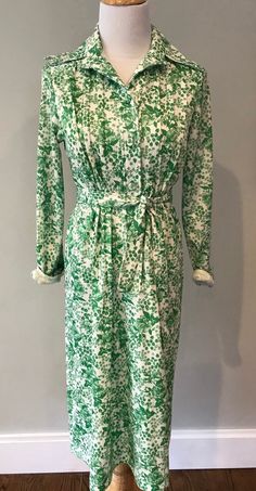 Super cute vintage floral shirtdress -green and white. Covered bottoms.  Size med/ large-  chest measurement is 17 across.  Good condition- fully lined . Green Cotton Shirt Dress For Day Out, Green Cotton Shirt Dress For Spring, Green Shirt Dress For Summer Dress Down, Green Shirt Dress For Summer, Green Shirt Dress For Daywear, Green Cotton Shirt Dress For Daywear, Green Long Sleeve Floral Print Shirt Dress, Green Cotton Midi Length Shirt Dress, Green Cotton Midi Shirt Dress