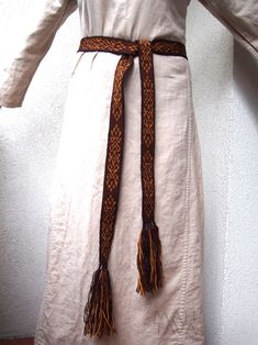 "This tablet woven woolen belt is made to order. It is a perfect addition to medieval and early medieval Viking costume. Length: about 197 cm (77,56\")+ a few centimeters of tassels Width: about 4 cm (1,57\") Colors: dark brown, light brown, yellow Material: pure wool Please note that due to different color adjustment of your and my screens the colors of the band may appear slightly different than they really are. You are most welcome to visit our facebook page: https://www.facebook.com/warsztat Traditional Brown Belt For Festivals, Medieval Reenactment, Viking Belt, Medieval Belt, Card Weaving, Viking Costume, Early Medieval, Tablet Weaving, Braids With Weave