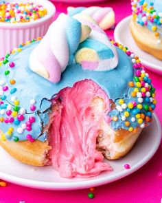 a doughnut that has been cut in half with sprinkles